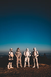 four Star Wars Stormtroopers cosplay standing on field thumbnail