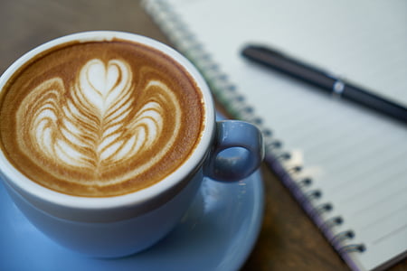 white ceramic cup filled with latte thumbnail