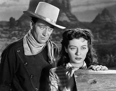 cowboy standing beside woman movie still thumbnail