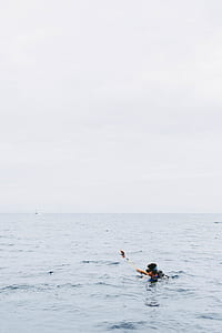 person body of water during daytime thumbnail