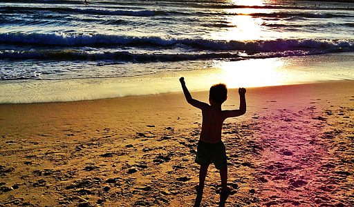 boy on seashore during sunset thumbnail