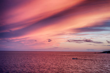 boat sailing on body of water thumbnail