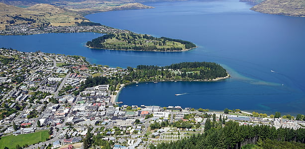 aerial view of island with buildings and trees thumbnail