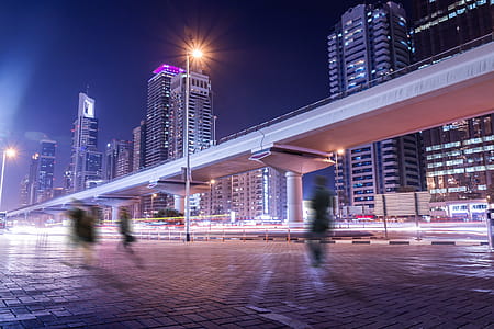 Amazing night atmosphere in Dubai. People on the street in motion thumbnail