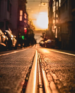 Road Between Buildings during Sunset thumbnail