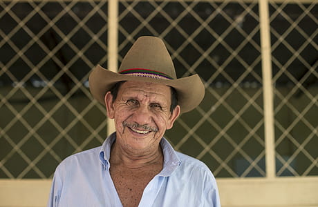 man taking photo near screen while smiling thumbnail