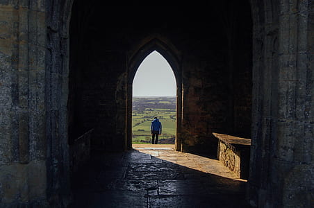 person in blue top standing thumbnail