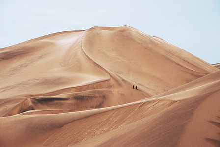 two people walking on desert thumbnail