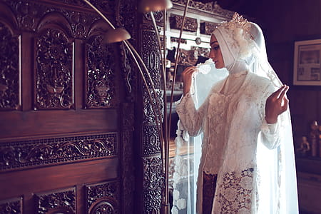 Woman Wearing Hijab Near Floor Lamp thumbnail