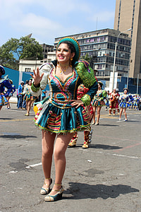 Woman in festival costume dancing in Lima, Peru thumbnail