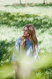 woman walking on green grass thumbnail
