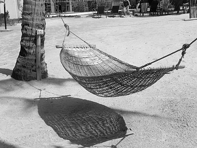 gray hammock on white sand thumbnail
