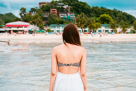 woman standing on body of water thumbnail