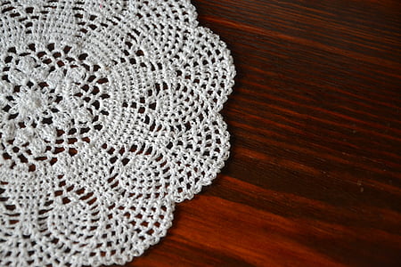 white knitted dishcloth on brown surface thumbnail