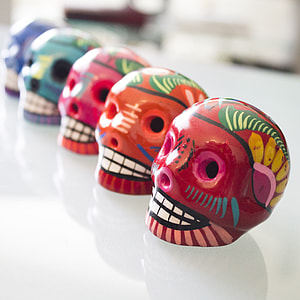 five assorted-color sugar skull decors thumbnail