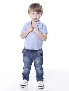 child in gray collared top and blue jeans thumbnail