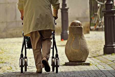 man walking with stroller thumbnail