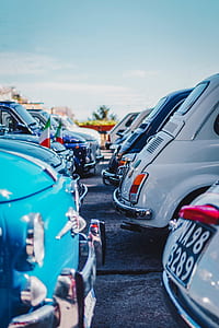 parked cars bumper to bumper at daytime thumbnail