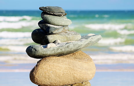 stacked rocks near seashore thumbnail