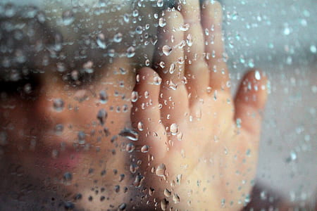 person touching clear glass thumbnail