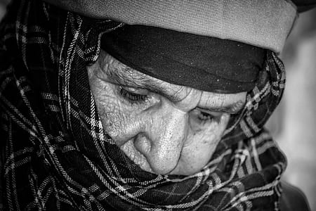 grayscale photography of person wearing plaid hijab headdress thumbnail