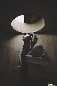 man standing under hole thumbnail