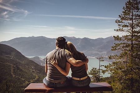 Man and Woman Sitting on Bench thumbnail