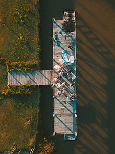 top view of people on top of gray dock during daytime thumbnail