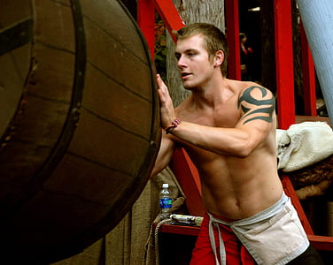 man pushing barrel thumbnail