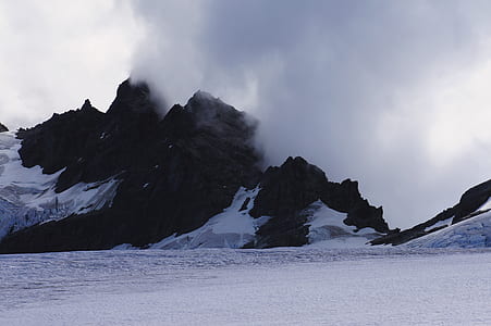 smoke over snow covered mountain thumbnail
