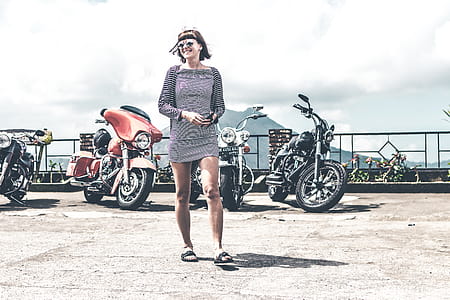 Photo of Woman Near Parked Motorcycles thumbnail