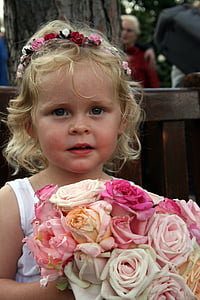 girl carrying flower bouquet thumbnail