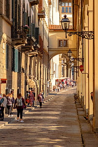 people standing between buildings thumbnail
