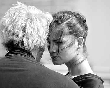 black and white photo of couple facing each other thumbnail