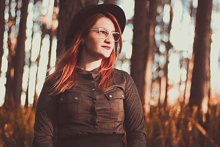woman wearing black clothes standing near trees thumbnail