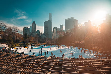 people on ice skating ring during daytime thumbnail