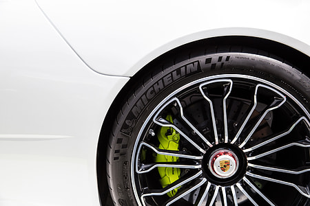 Closeup shot of the alloy wheel of a Porsche racing sports car thumbnail
