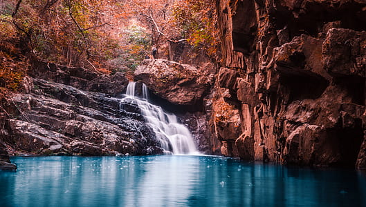 waterfalls streaming trough rocks thumbnail