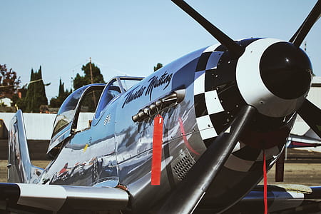 close-up photography of white and black biplane thumbnail
