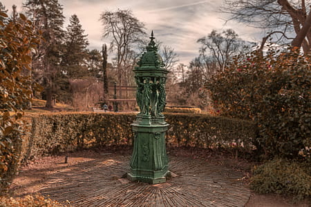 green statue beside green leafed tree thumbnail