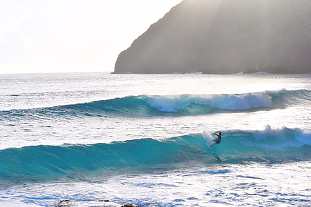 person on surfboard riding on wave thumbnail