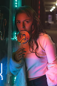 woman eating lollipop thumbnail