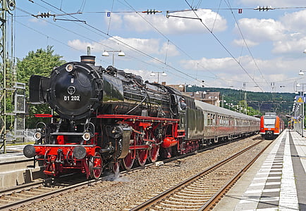 black and red train station under cloudy sky thumbnail