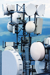 close-up photography of white and black metal electric tower at daytime thumbnail