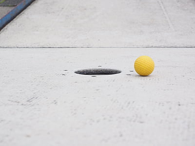 yellow ball near hole thumbnail