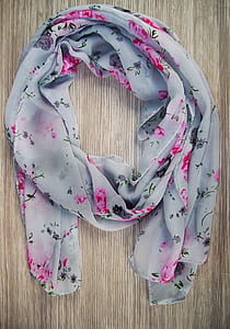 white, pink, and green floral scarf on brown surface thumbnail