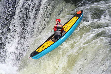 person on teal kayak during daytime thumbnail
