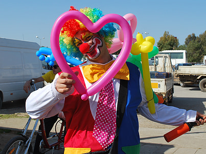 clown holding heart shaped balloon thumbnail