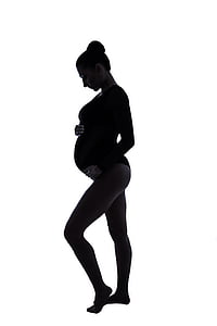 pregnant woman holding her tummy thumbnail