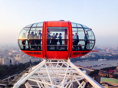 people riding on red amusement ride thumbnail